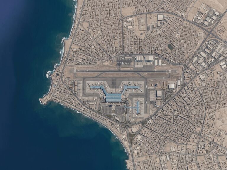 Aerial view of an international airport with runways and terminal buildings